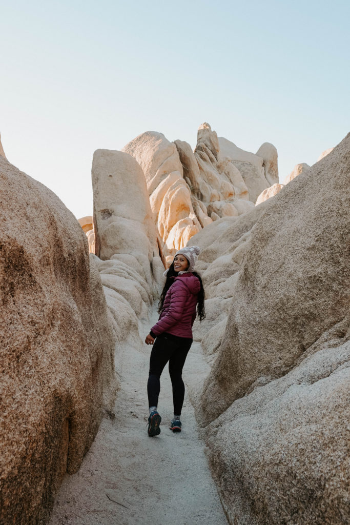 hiking between boulders in Arch Rock trail