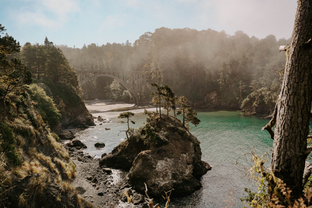 Large rock in the middle of the coastline with turquoise water in Mendocino