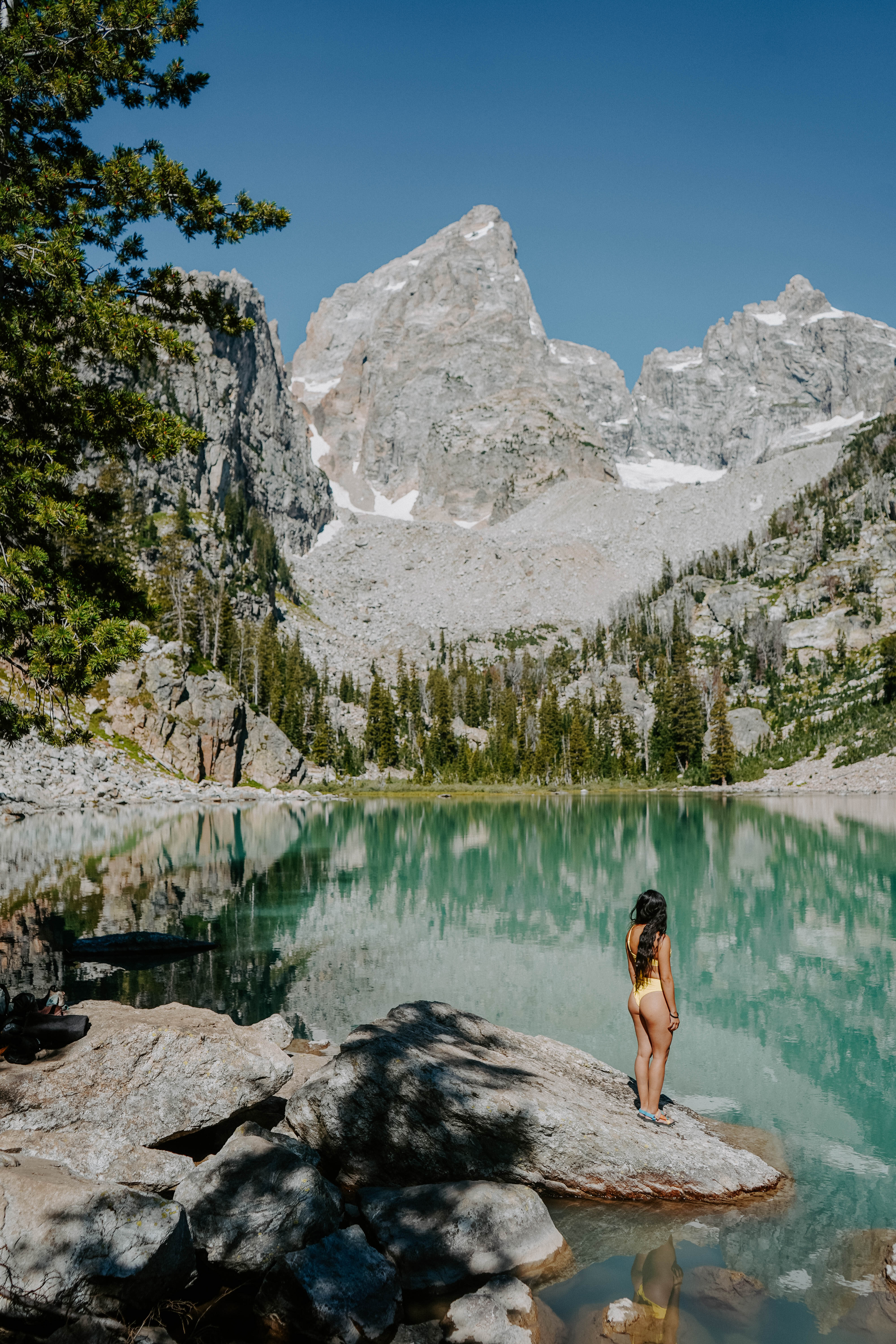 Turquoise lake with snowy mountain peaks in Wyoming 