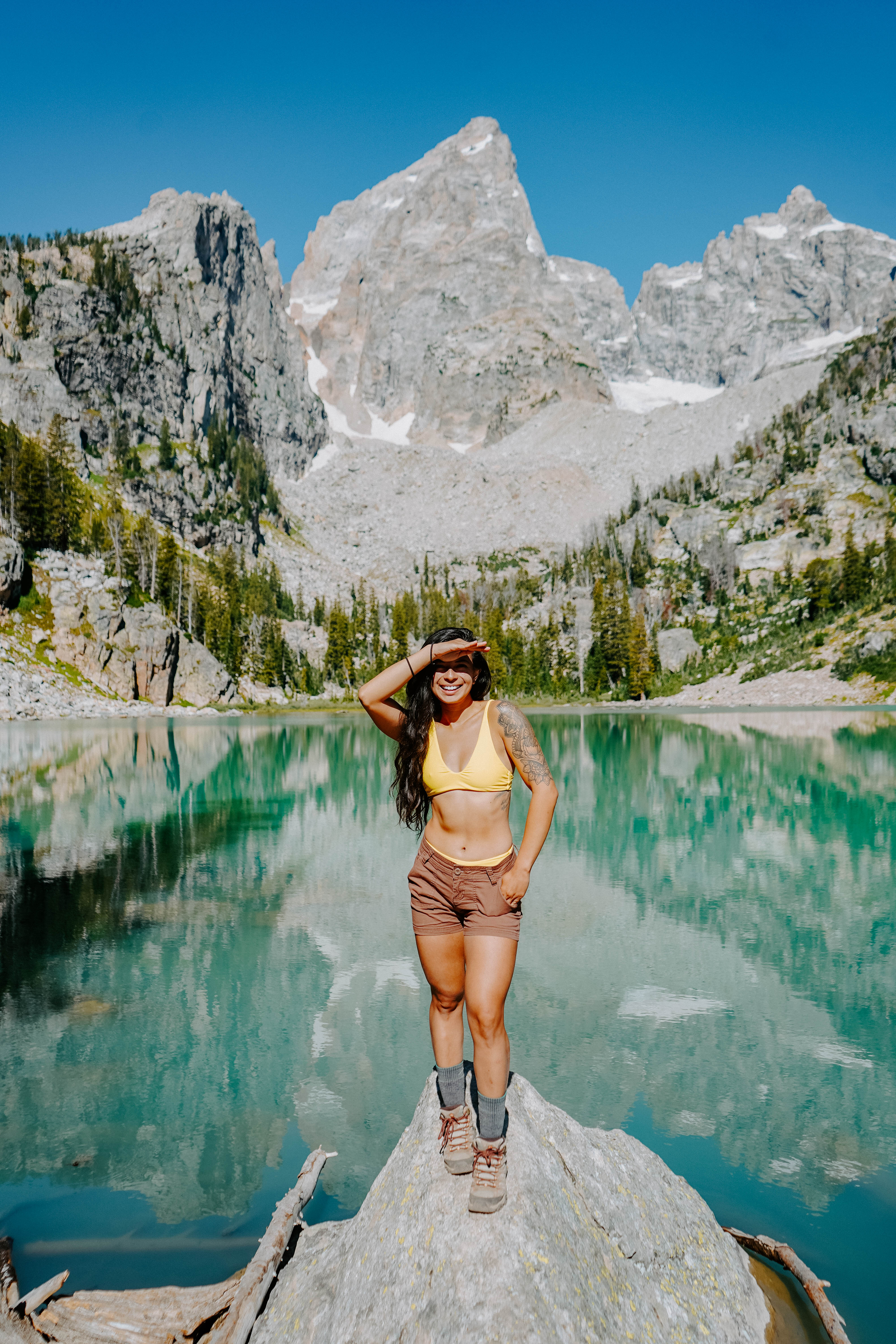 Turquoise lake with snowy mountain peaks in Wyoming 