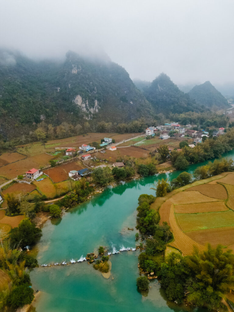 drone shot overlooking the river and rice terraces in Cao Bang