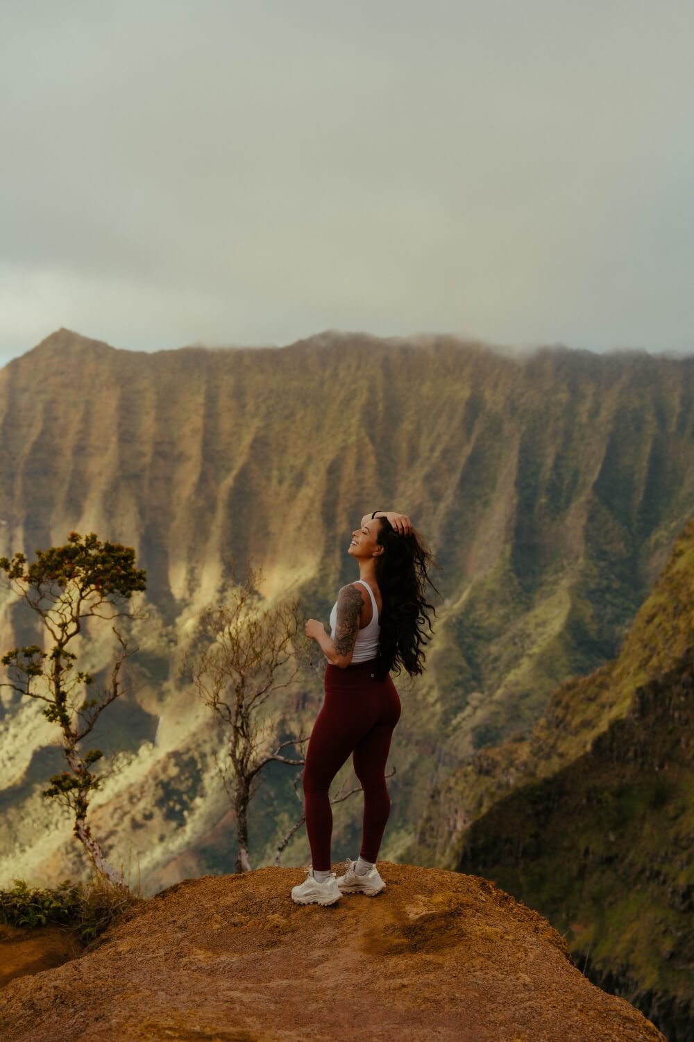 girl looking at a ridge in kauai