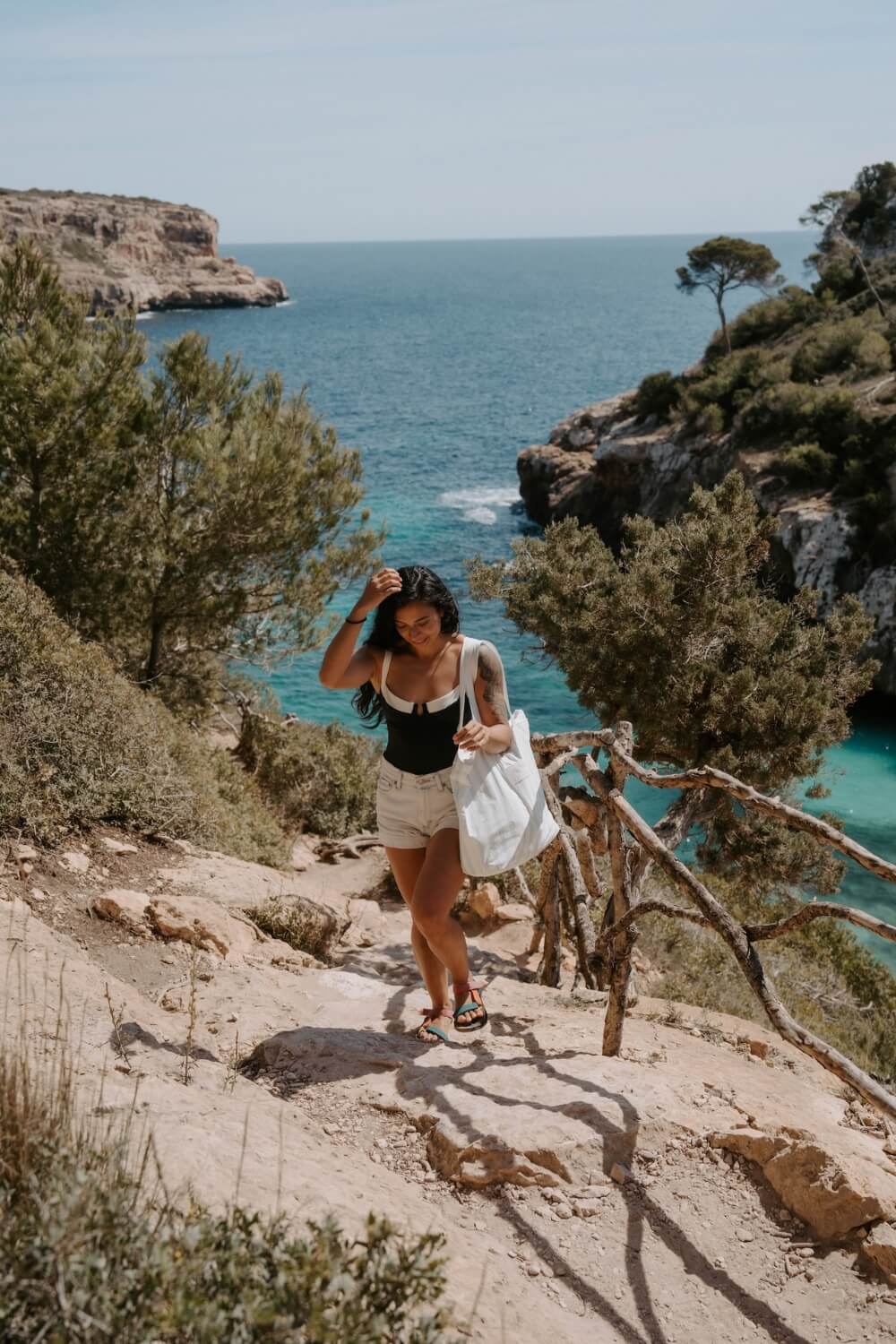 girl walking in Mallorca Calo del Moro