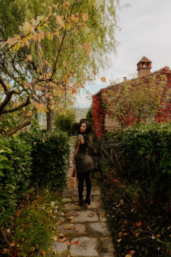 girl standing in front of a house in italy