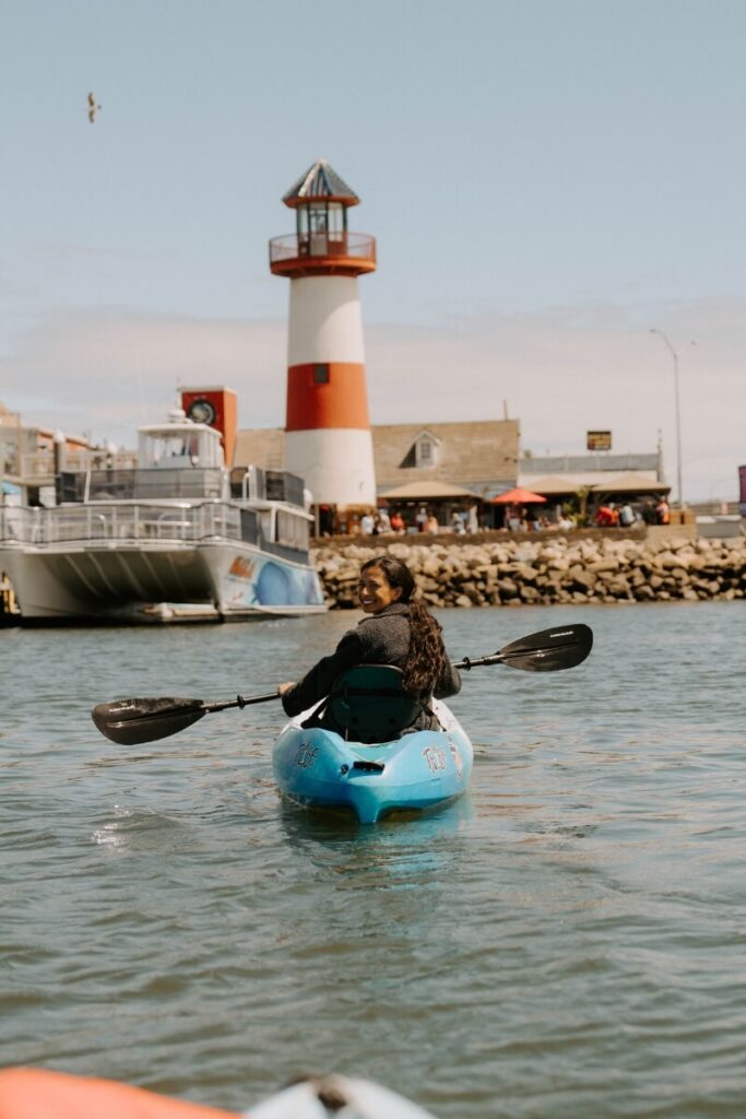 kayaking in front of oceanside lighthouse
