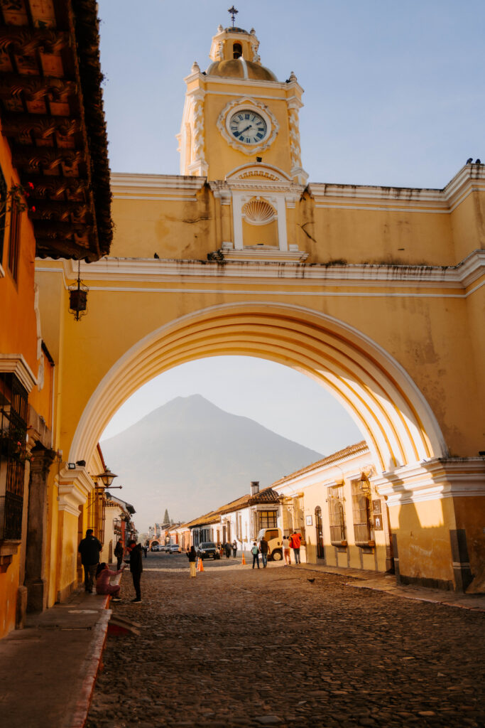 Yellow arch and cobblestone street in Antigua