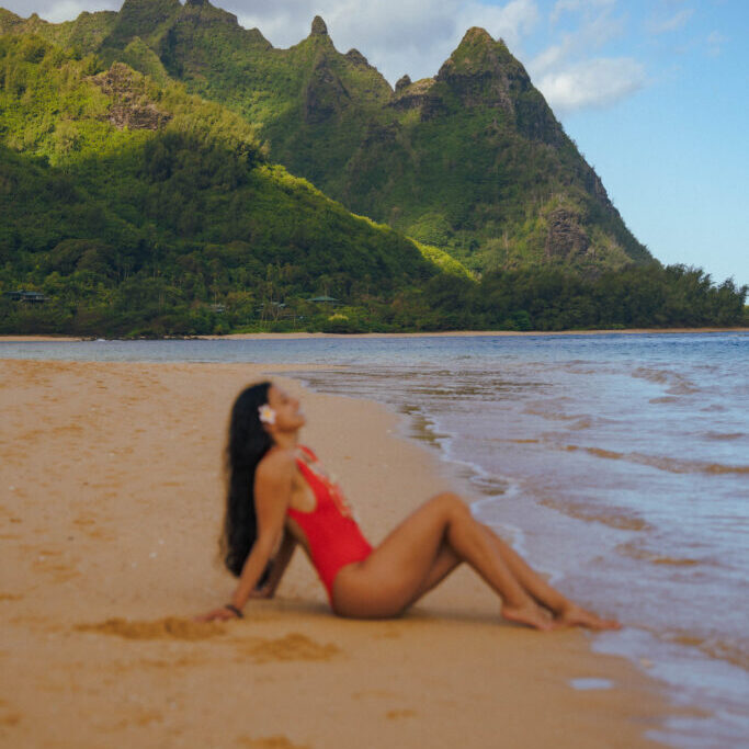 girl sitting at Tunnels Beach Hawaii