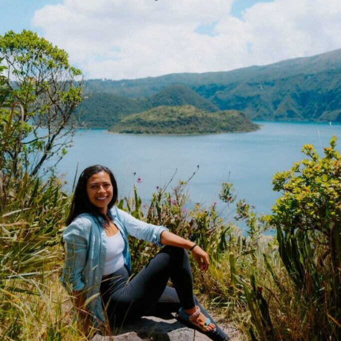 girl sitting in front of ecuador otavalo lake